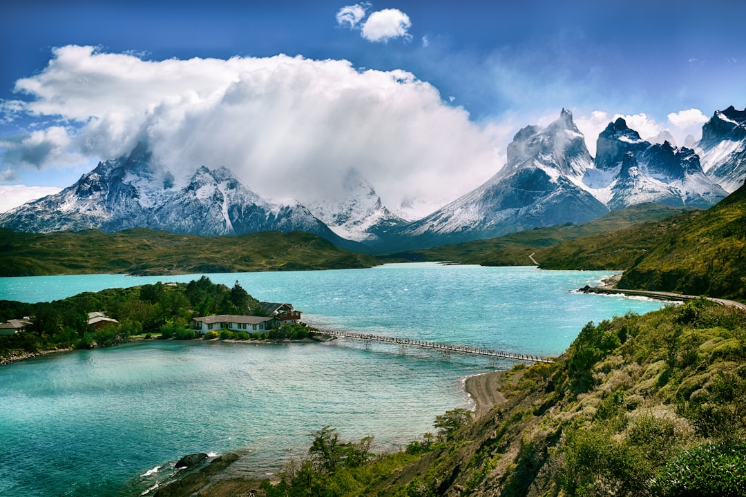 Photo by Olga Stalska lake near snow-covered mountain during daytime