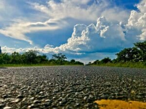 gray road under white clouds