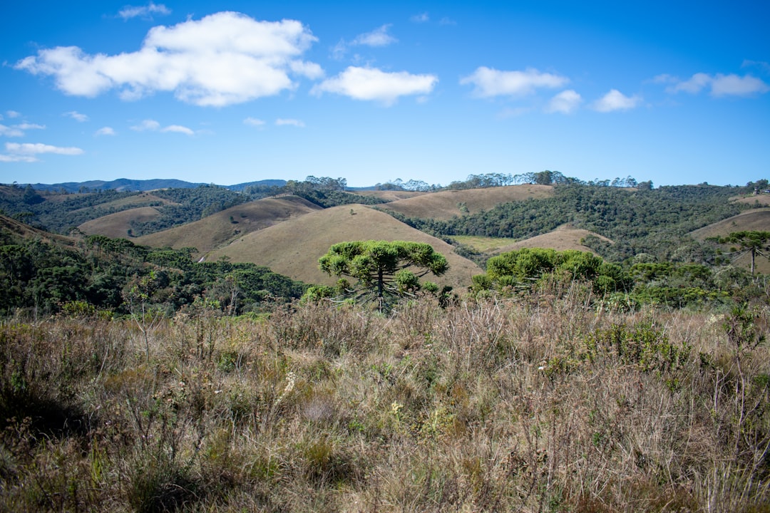 Photo by Caio Pezzo - Viaggi Over 55 brown grass field and brown mountain