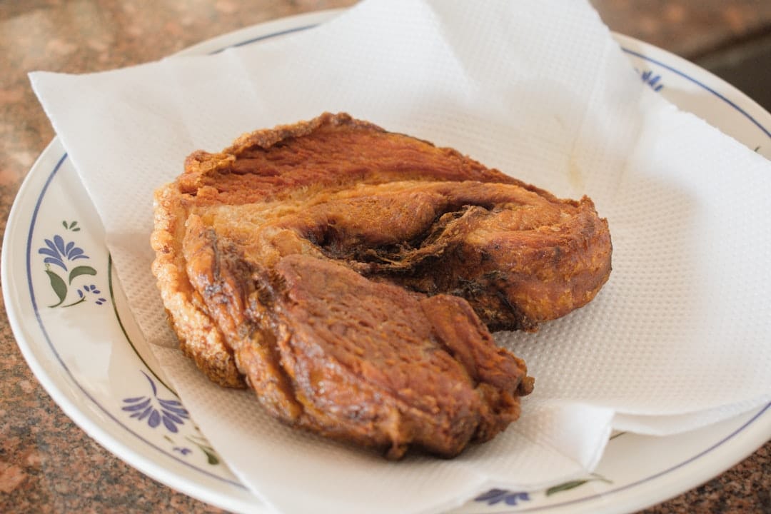 Photo by Caio Pezzo - Viaggi Over 55 fried meat on tissue on plate