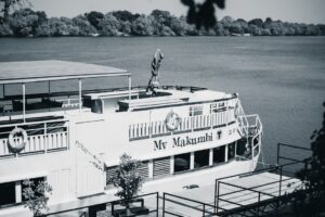 A black and white photo of a boat in the water