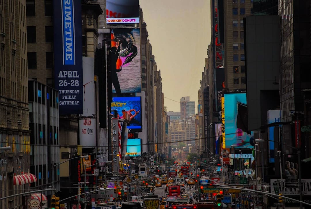 Photo by Mauro Angeli A city street filled with lots of tall buildings