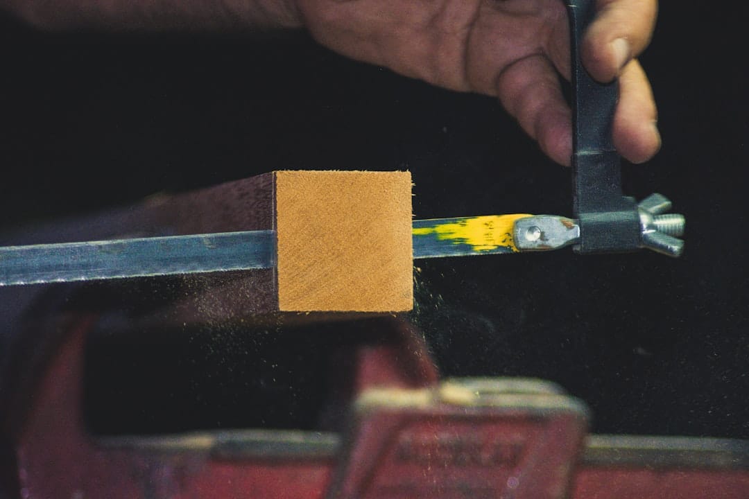 Photo by Caio Pezzo - Viaggi Over 55 person sawing timber