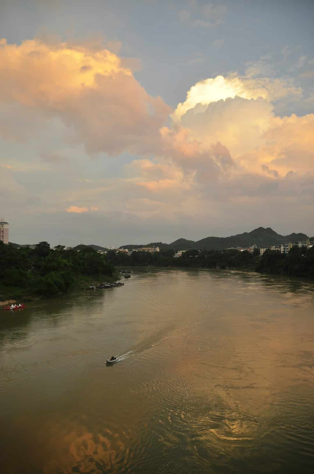 a body of water with a boat in the middle of it