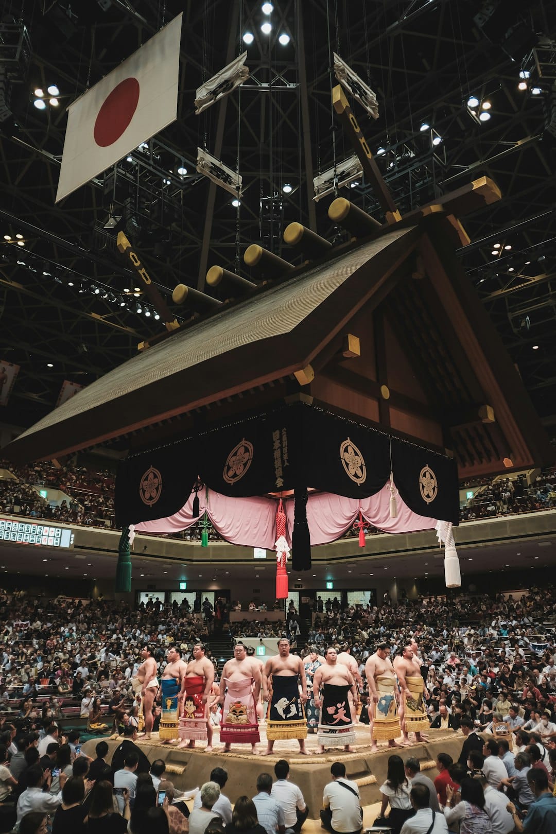 Photo by Florian Hahn A group of men standing on top of a stage